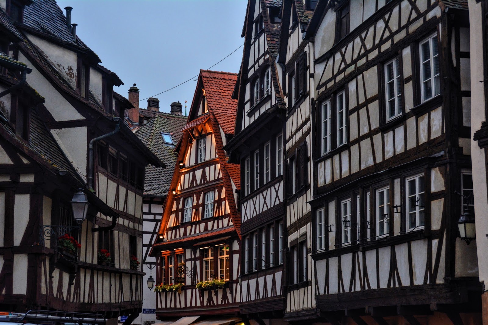 This is a photo of brown and black timbered houses in Strasbourg, France from the post 'How to plan Your Eurotrip'