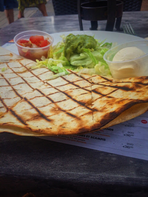 Tortilla with salsa and cream