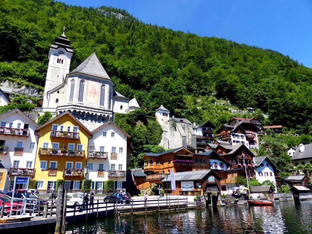 A photo of a quaint little village by the side of a lake