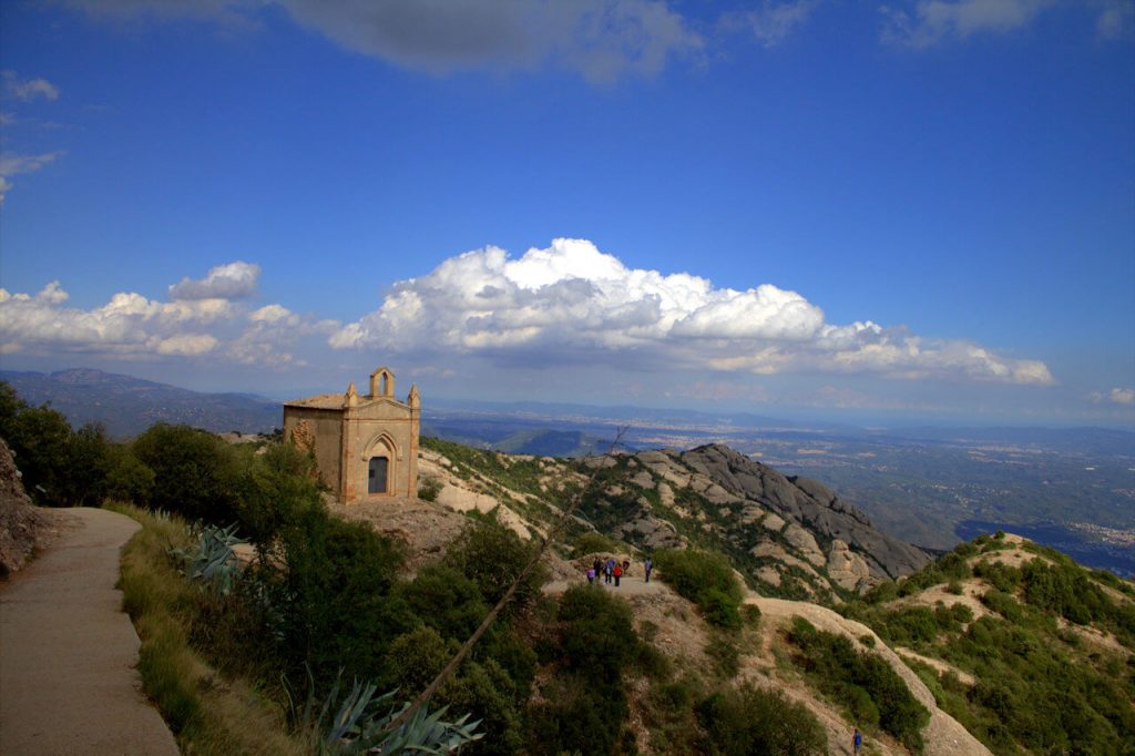 A photo of a monastery high up in the mountains