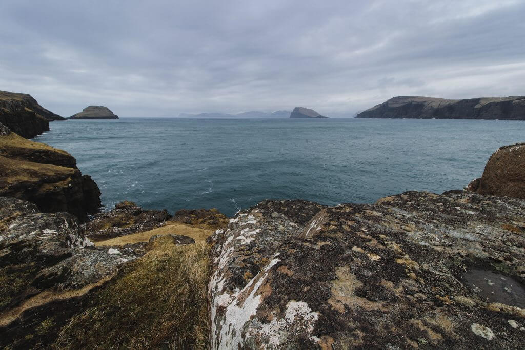 A photo of the sea surrounded by rocks