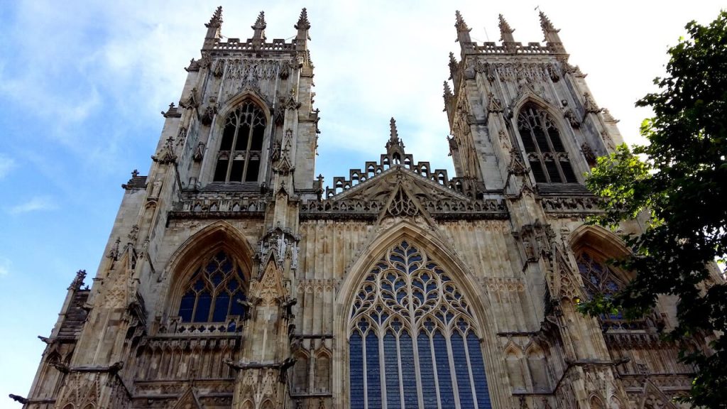 A picture of a stone cathedral with many spires