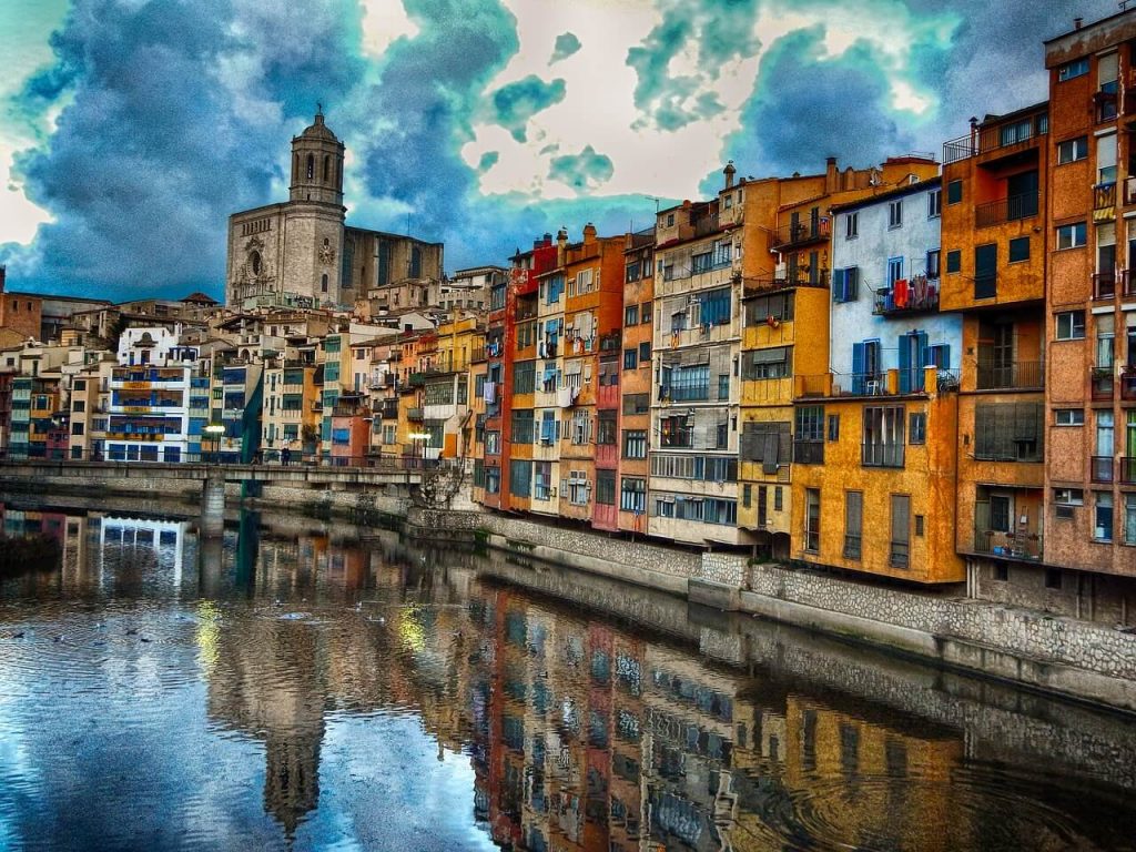A picture of lots of colourful buildings near a waterfront
