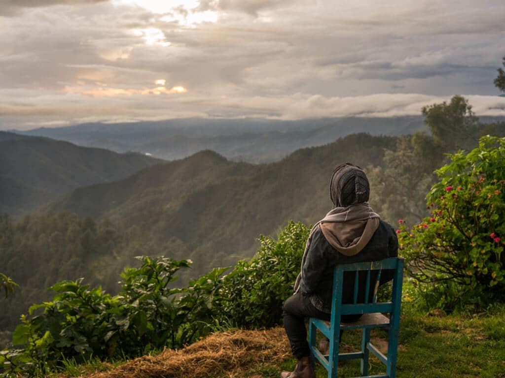 A man overlooking sunrise over the mountains